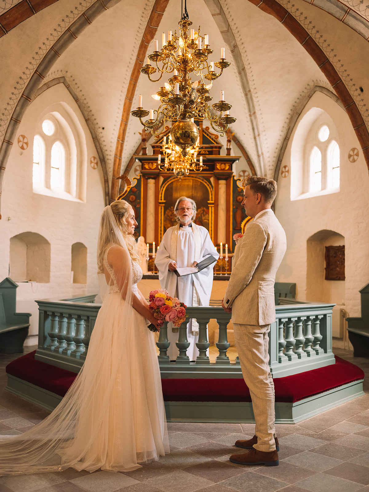 Alice and Marcus at the altar of Fru Alstads kyrka