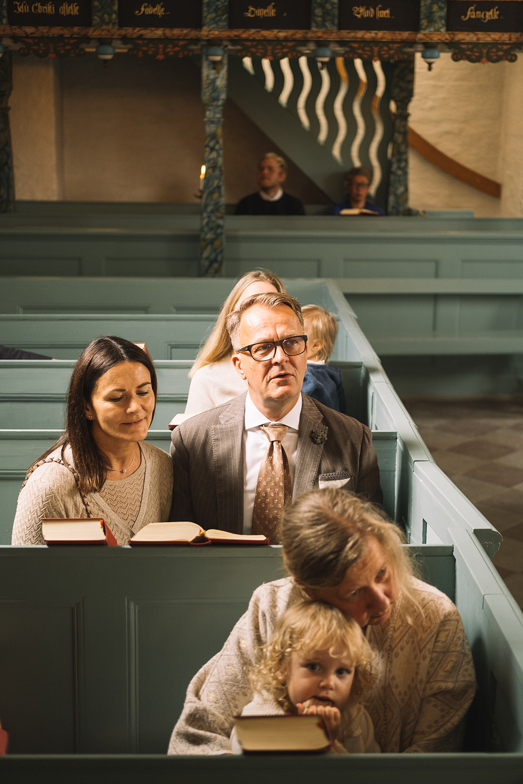 Family in the pews during the ceremony