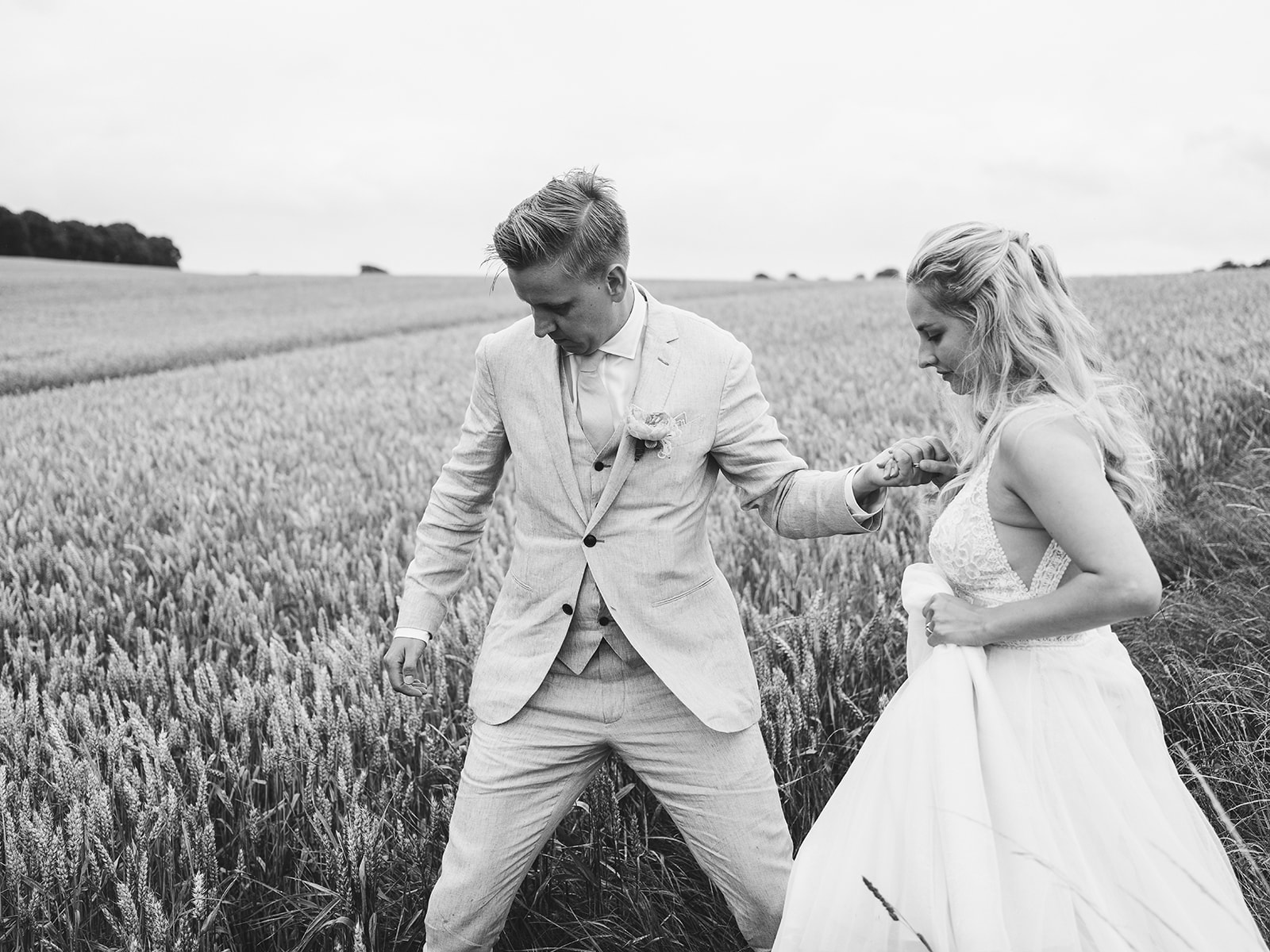 Alice and Marcus laughing in the wheat