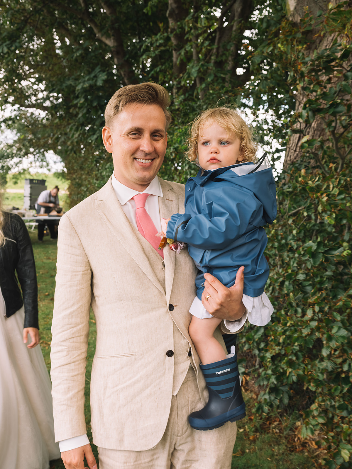The groom with a small boy in the garden