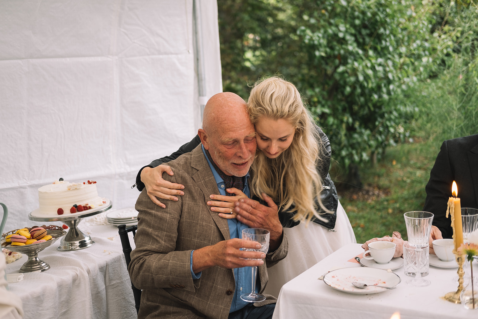 The bride with her grandfather at the table