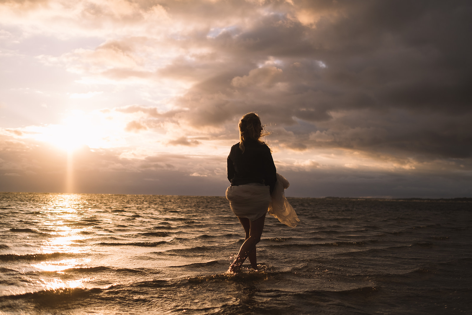 A silhouette against the low sun on the water at Lomma