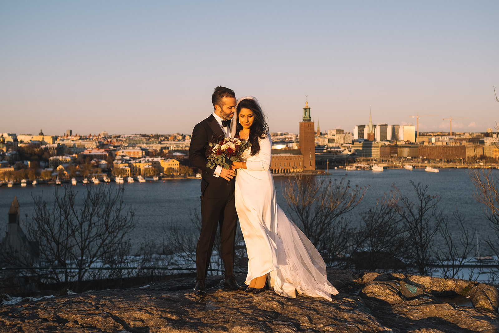 Lisa and Olof at Skinnarviksberget with the Stockholm skyline