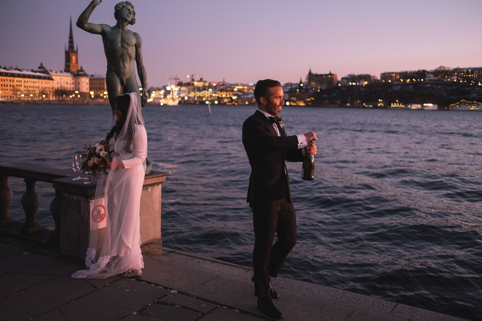 Stockholm city hall wedding, champagne on the terrace at dusk
