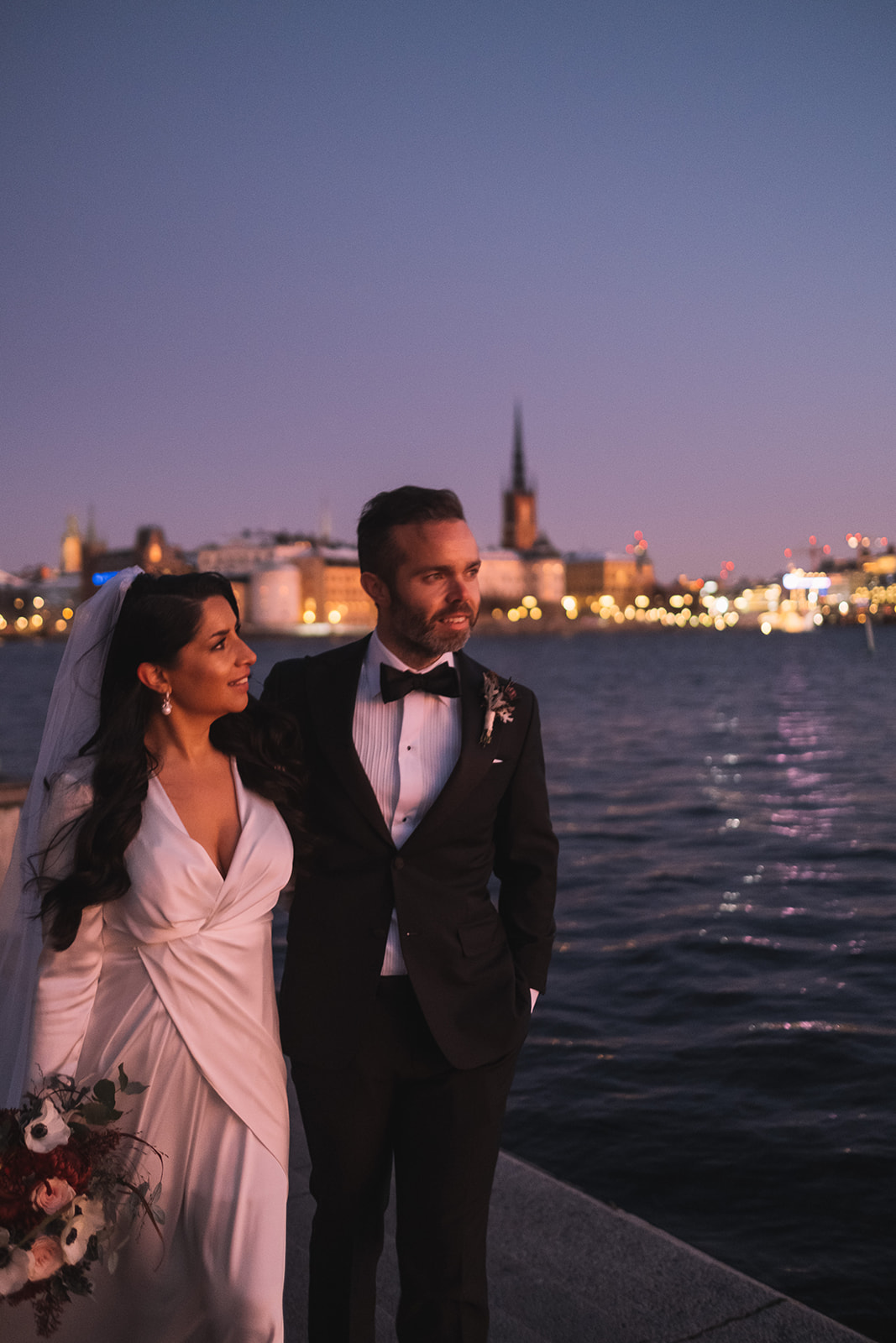 Lisa and Olof with the lights of Stockholm across the water