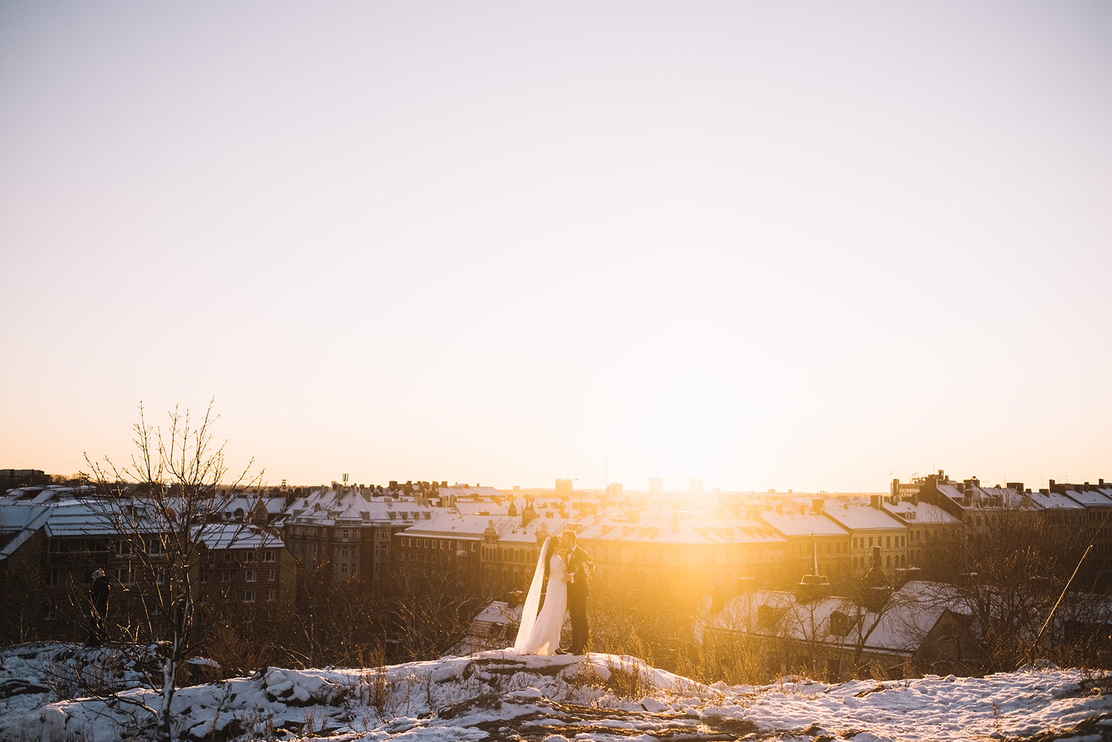 The bride on the rock at Skinnarviksberget as the sun sets
