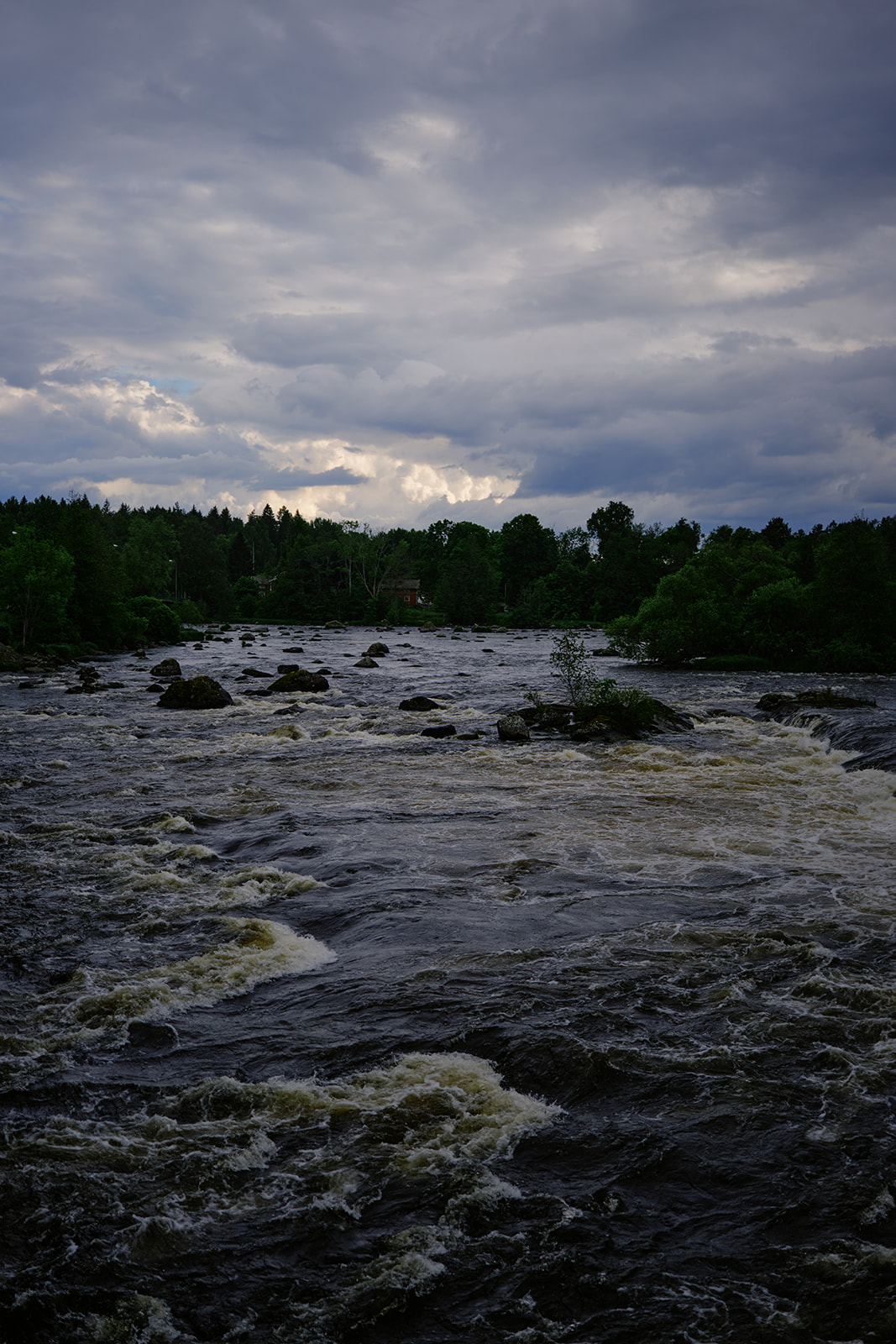 The Dal&auml;lven running past Gysinge under a heavy sky