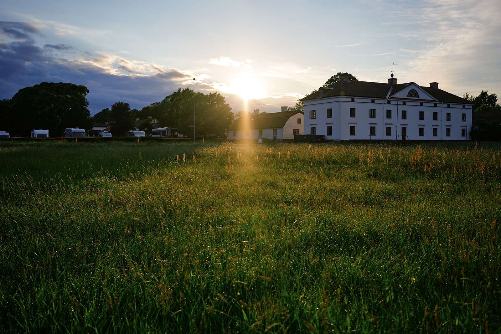 Gysinge Herrg&aring;rd at sunset across the meadow