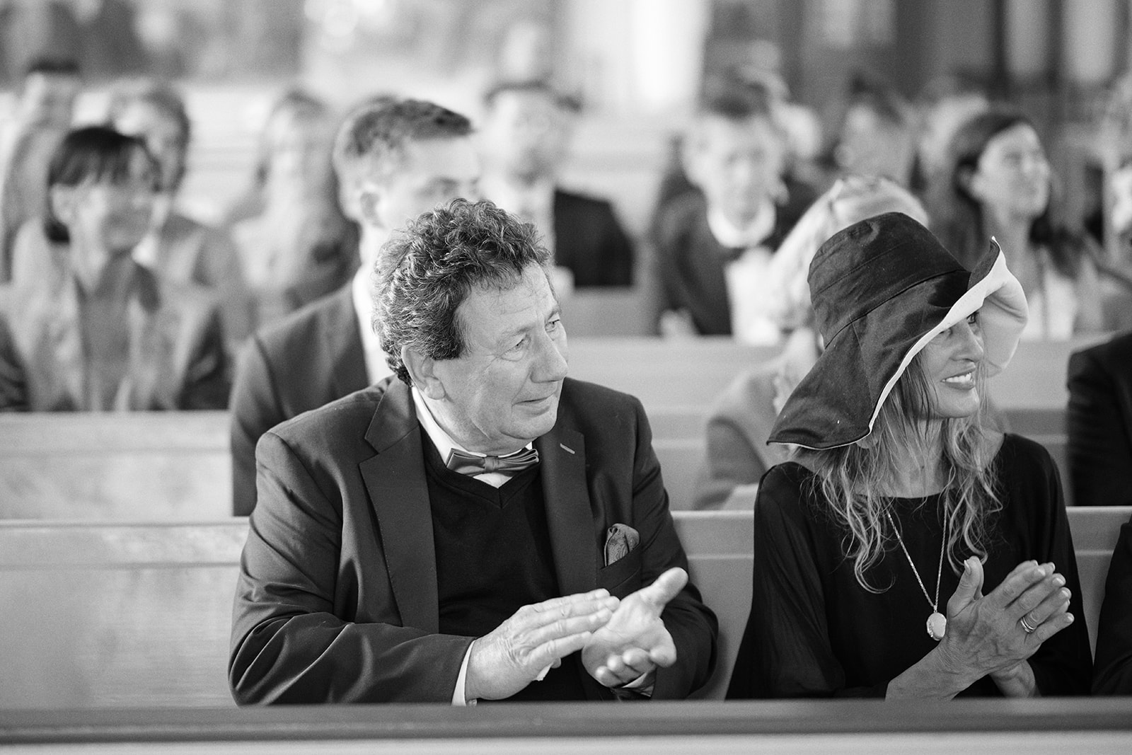 A guest in the pews during the ceremony, black and white