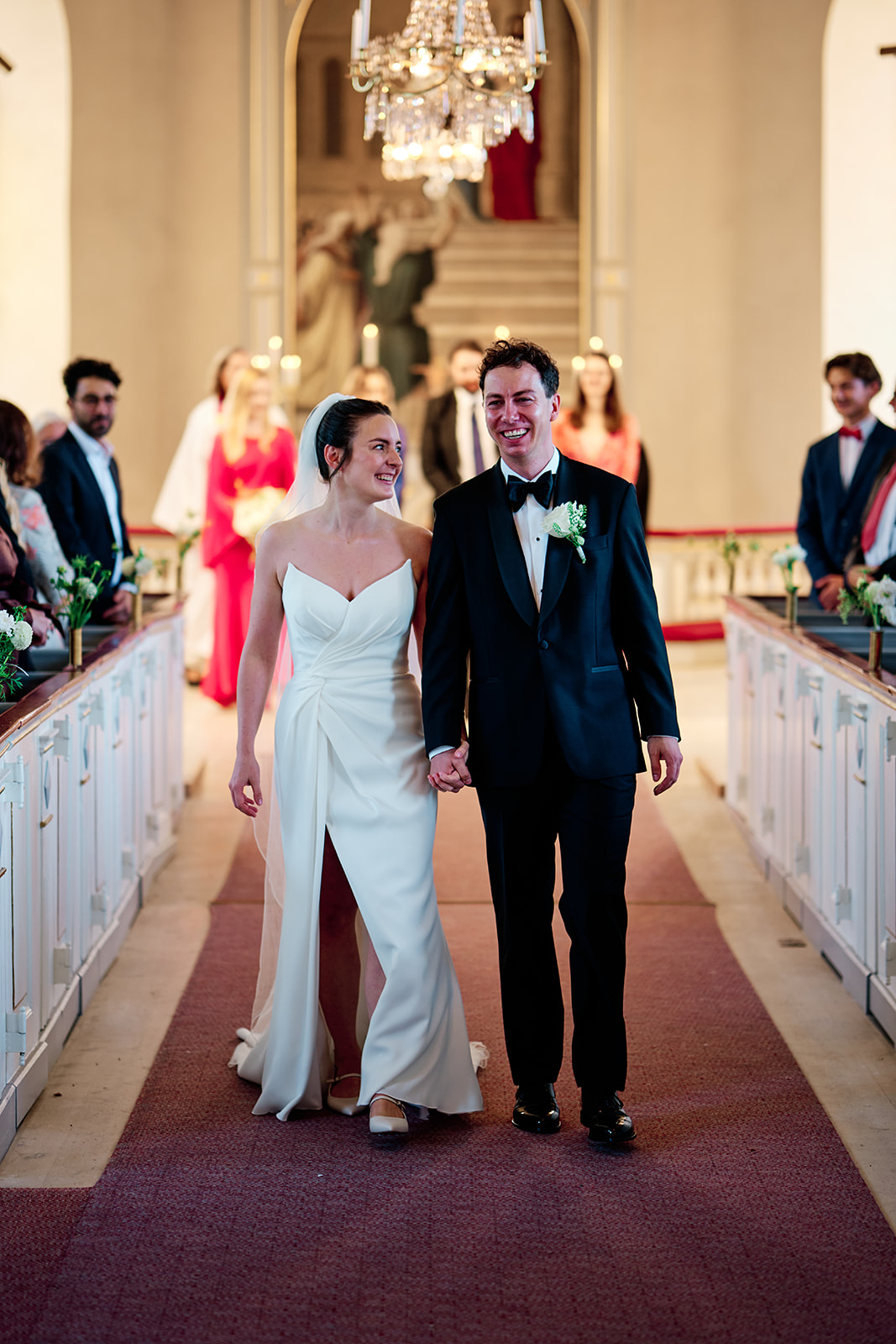 Bride and groom walking back down the aisle