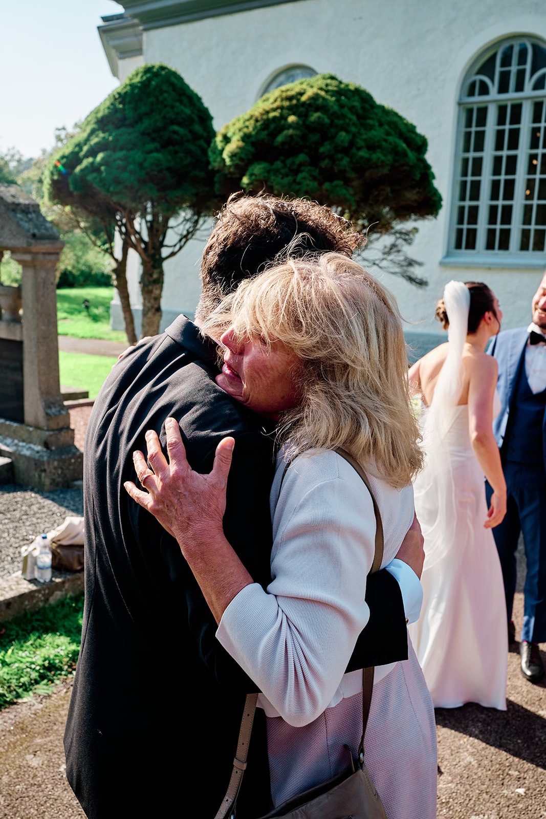 An emotional hug outside the church after the ceremony