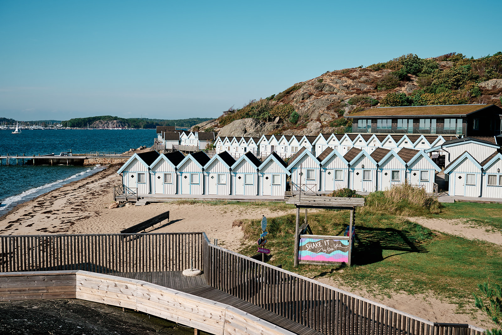 The row of pale blue bathing cabins at Hov&aring;s Kallbadhus