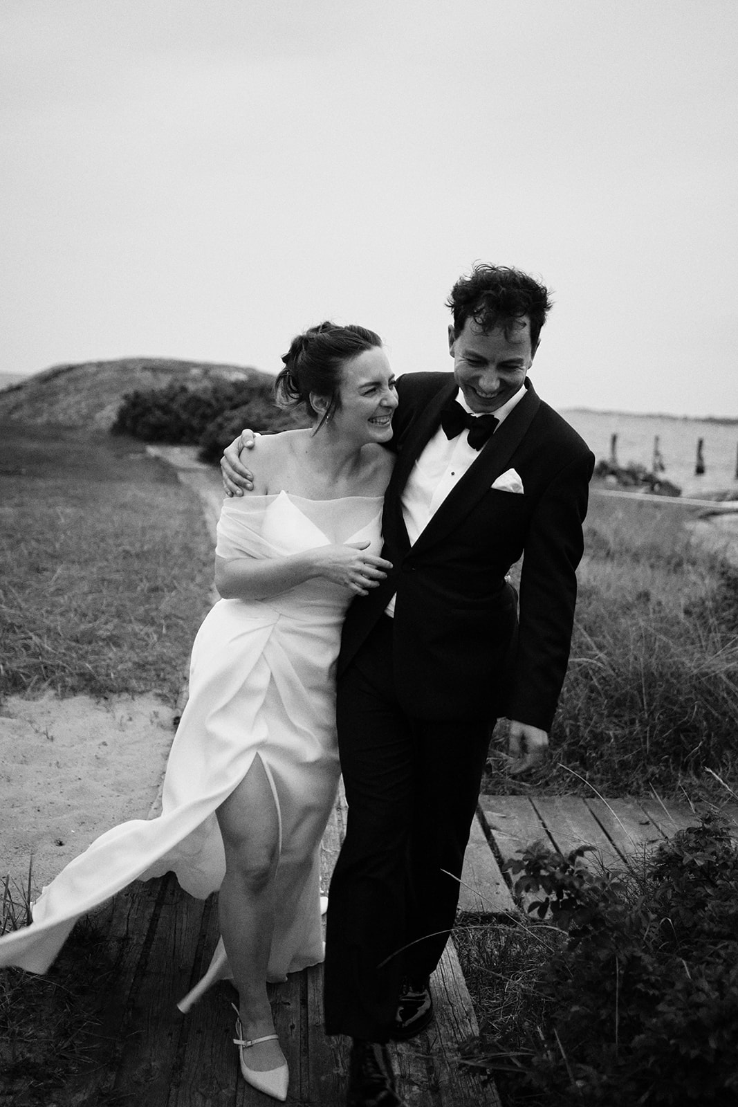 The couple walking together on the coast, black and white